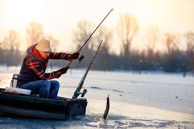 happy-elderly-fisherman-catch-fish-on | fishing gear