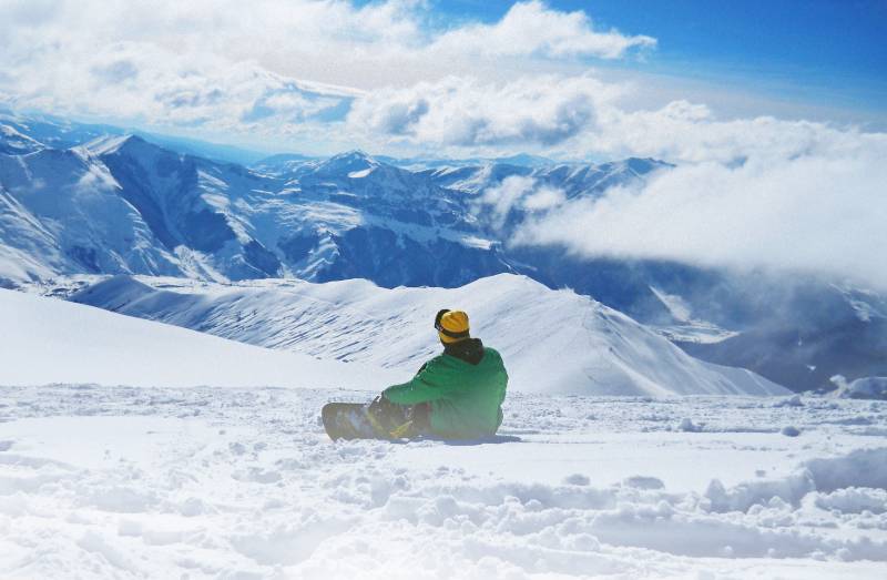 man snowboarding on snow during daytime | snowboarding canada
