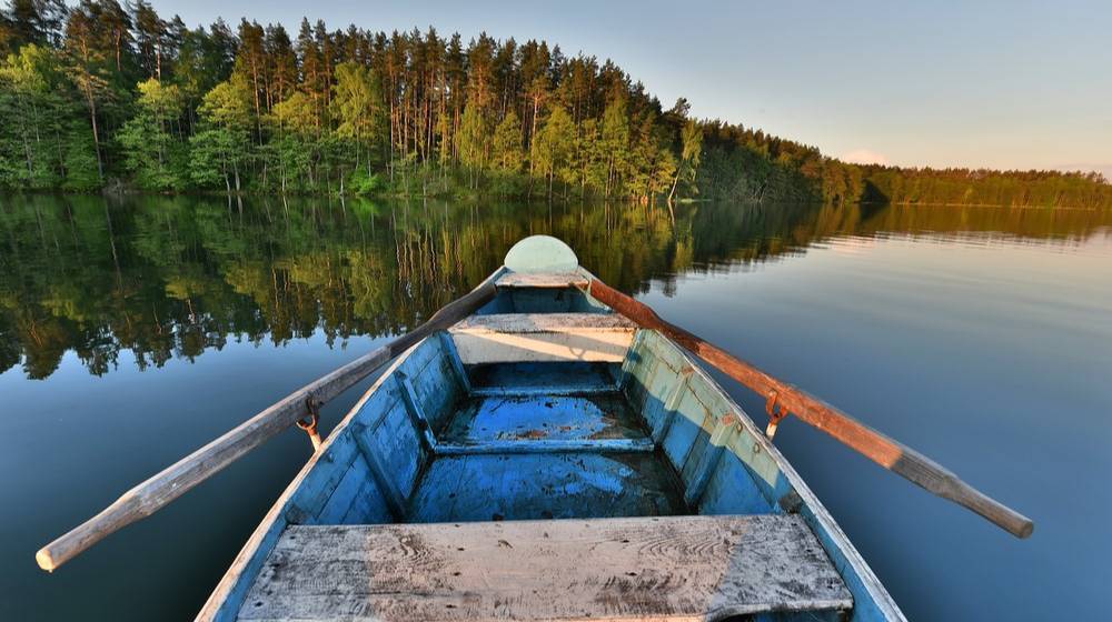 fishing-boat-calm-lake-waterold-wooden | Lake Fishing Tips And What You Need To Know About Them | Featured