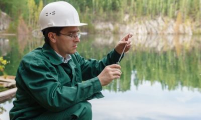 industrial-ecologist-or-chemist-takes-a-sample-of-water-from-lake-at-the-site-of-a-flooded-mining-pit | Non-Potable Water | Types and How to Spot Them | featured