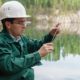 industrial-ecologist-or-chemist-takes-a-sample-of-water-from-lake-at-the-site-of-a-flooded-mining-pit | Non-Potable Water | Types and How to Spot Them | featured
