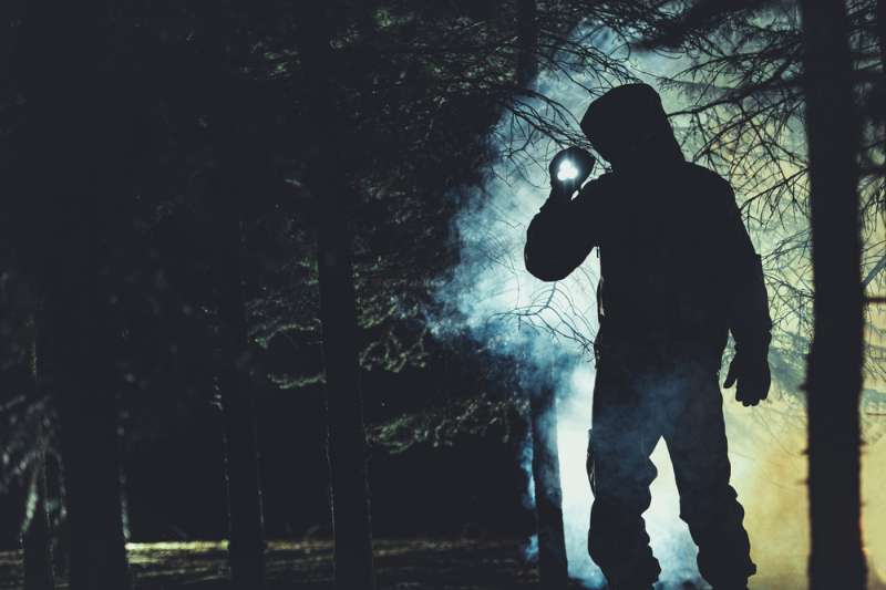mysterious-men-flashlight-his-hand-dark coyote | utah coyote hunting license