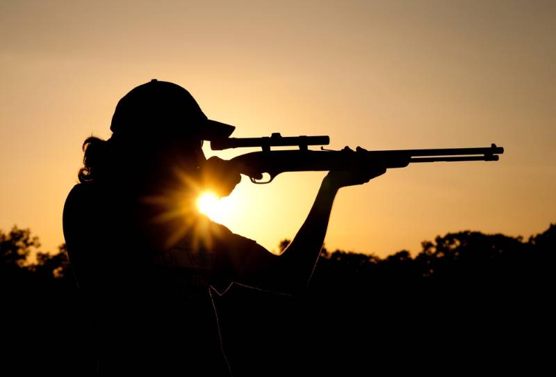 silhouette-young-man-shooting-long-rifle | best hunting rifle