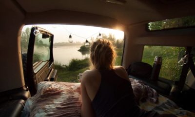 woman-camping-camper-car-drinking-morning | Car Camping Hacks: Different Ways To Sleep In Your Vehicle | Featured