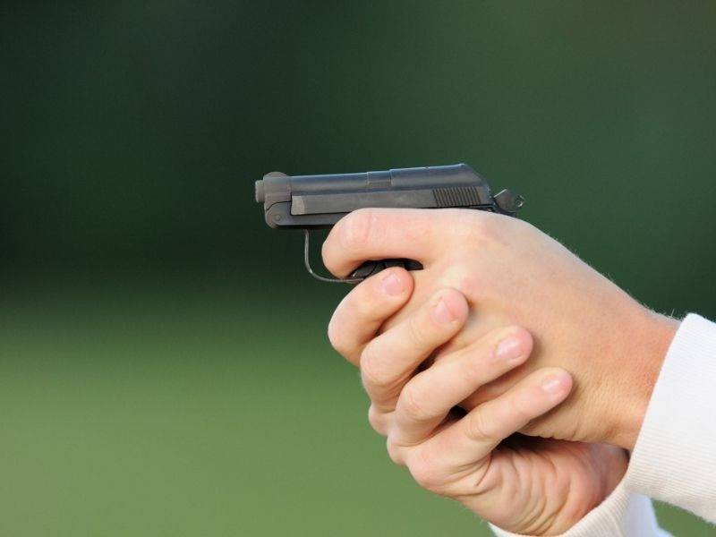 male-hand-aiming-small-pocket-pistol | beretta 21a bobcat holster
