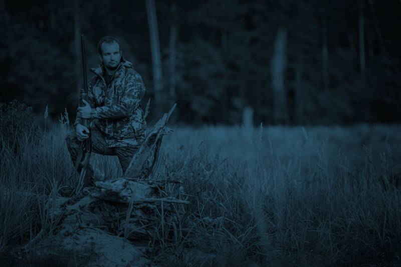 Male hunter in camouflage clothes ready to hunt with hunting rifle | coyote hunting at night in KY