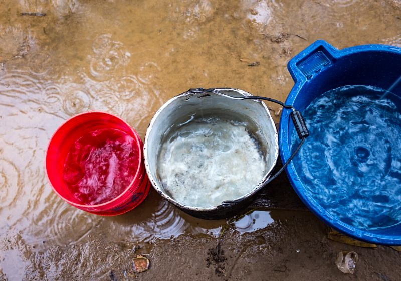 blue white red plastic buckets filled | primary drinking water standards