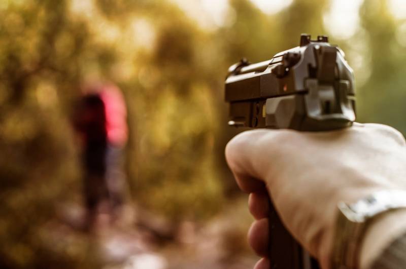 shooter-beretta-m9-black-gun-shooting | beretta 21a bobcat reviews