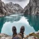 Brown military shoes of hiker in front of mountain lake Kel Suu-hiking boot-ss-featured