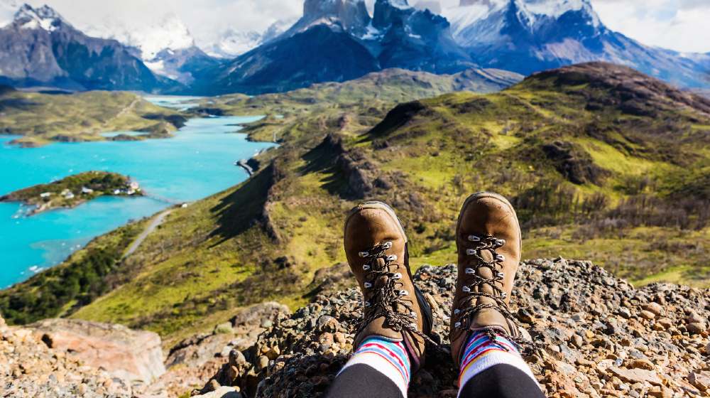 Girl hiking boots having fun and enjoying wonderful breathtaking mountain view-hiking boots-ss-featured