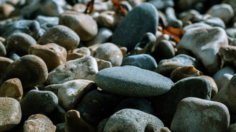 Stones on a pebble beach in Brighton | stone tools in human evolution
