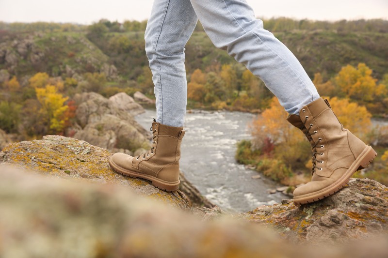 Woman wearing stylish hiking boots on steep cliff-hiking boot-ss