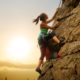 beautiful-woman-climbing-on-high-rock | Women Climbers: Lauren Delaunay Miller's Experience With Rock Climbing [LISTEN] | Featured