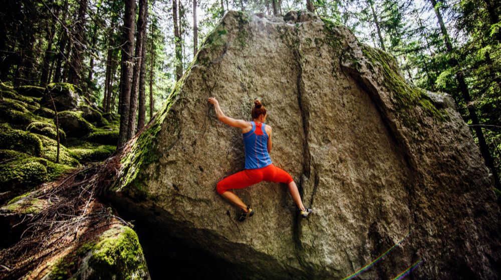girl-climbing-hard-boulder-problem-forest | Bouldering In Yosemite With Jim Reynolds | Enormocast Podcast [LISTEN] | Featured