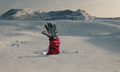 hiker-stretching-out-his-snow-covered | Skiing Avalanche Survival Story | The Outside Podcast | Featured