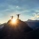 two-hikers-silhouette-stands-on-rock | Climbing A Mountain And The Dangers Of It | The Outside Podcast [LISTEN] | Featured